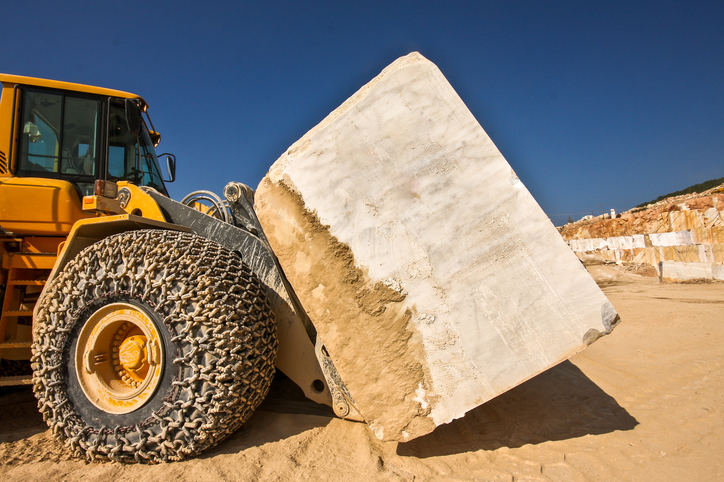 Wheel loader carrying a marble block